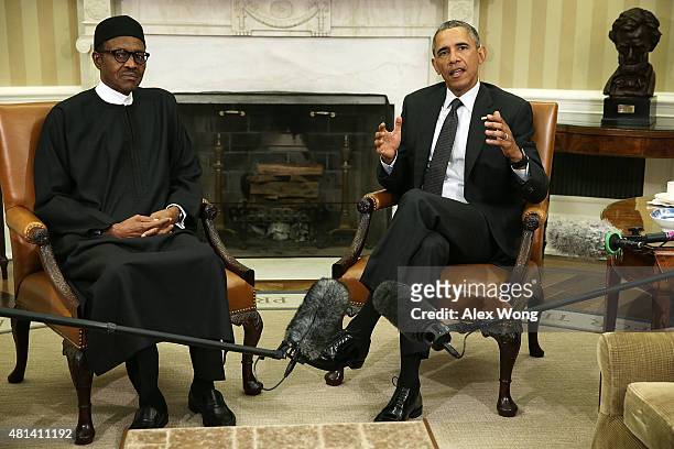 President Barack Obama speaks as Nigerian President Muhammadu Buhari listens during a meeting in the Oval Office of the White House July 20, 2015 in...