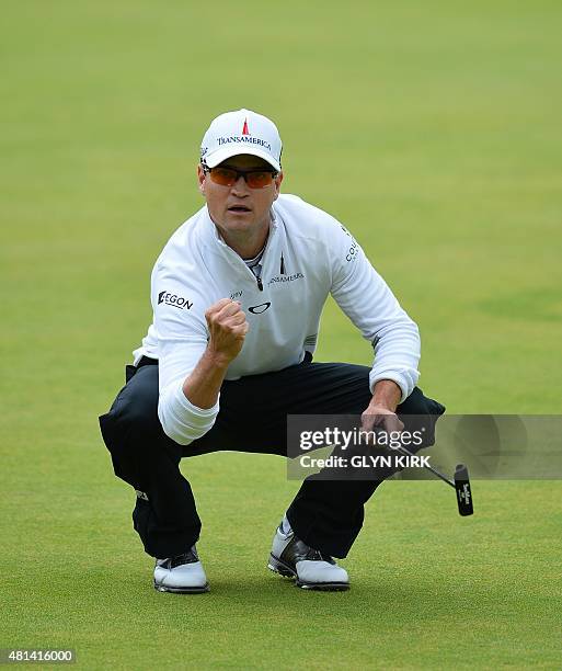 Golfer Zach Johnson celebrates making his birdie putt on the 18th green during his final round 66, on day five of the 2015 British Open Golf...