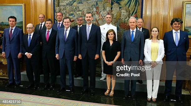King Felipe VI of Spain poses with the prime minister, Mariano Rajoy, the vice president, Soraya Saenz de Santamaria, the minister of Industry, José...