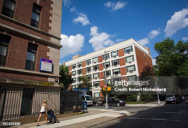 Woman walks along the Long Island College Hospital campus on Amity Street June 19, 2015 in the Brooklyn borough of New York. The Fortis Property...