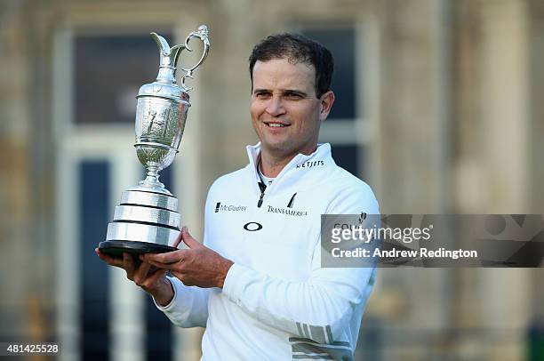 Zach Johnson of the United States holds the Claret Jug after winning the 144th Open Championship at The Old Course during a 4-hole playoff on July...