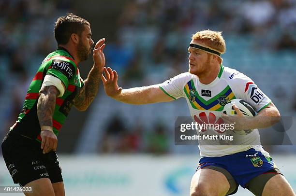 Joel Edwards of the Raiders looks to get past Adam Reynolds of the Rabbitohs during the round four NRL match between the South Sydney Rabbitohs and...