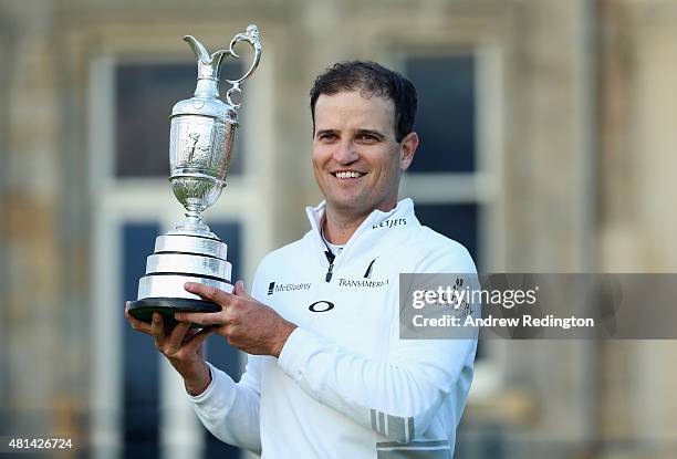 Zach Johnson of the United States holds the Claret Jug after winning the 144th Open Championship at The Old Course during a 4-hole playoff on July...