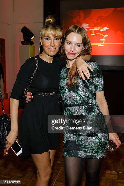 Senna Gammour , and Julia Dietze pose at the Gala Night of the FIFA World Cup Trophy Tour on March 29, 2014 in Berlin, Germany.