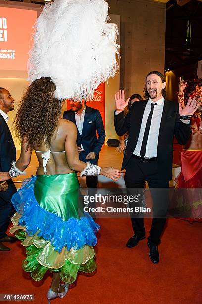 Neven Subotic dances during a performance of Dancers of Tangara Brasil Dance at the Gala Night of the FIFA World Cup Trophy Tour on March 29, 2014 in...