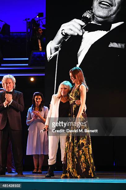 Nancy Sinatra and daughter Amanda Lambert bow at the curtain call during the press night performance of "Sinatra At The London Palladium" at the...