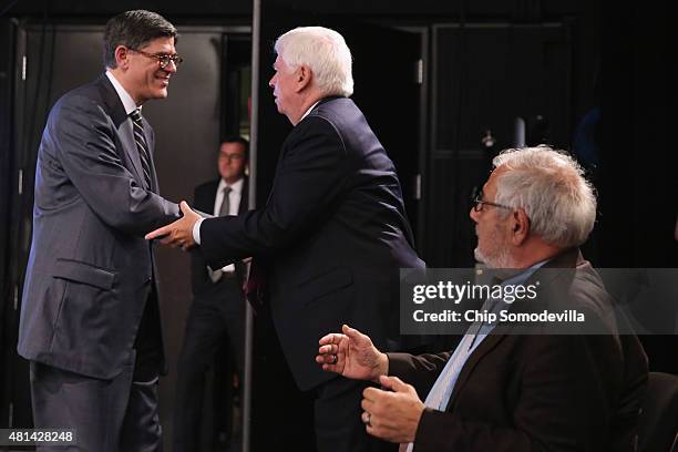 Treasury Secretary Jack Lew thanks former Sen. Chris Dodd and former Rep. Barney Frank after delivering the keynote address during an event marking...