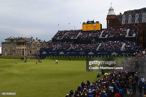 Zach Johnson of the United States celebrates a birdie putt on the 18th green during the final round of the 144th Open Championship at The Old Course...