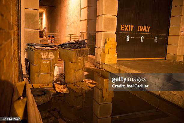 trash receptacles in the city - trespassing stock pictures, royalty-free photos & images