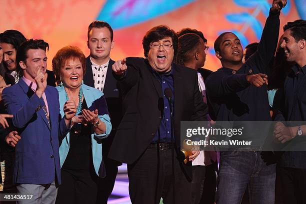 Writer/producer Dan Schneider accepts the Lifetime Achievement Award onstage with actors from his shows during Nickelodeon's 27th Annual Kids' Choice...