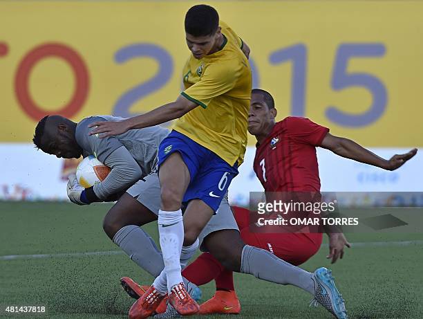 Brazilian goalkeeper Andrey Da Silva catches the ball in front of teammate Vinicius De Freitas and Panamanian Jairo Jimenez during the Pan American...