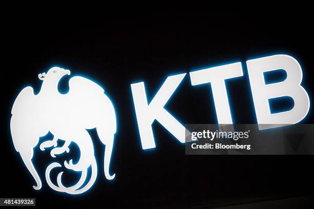The Krung Thai Bank Pcl logo is illuminated outside a branch at night in the Silom area of Bangkok, Thailand, on Monday, July 20, 2015. Krung Thai...