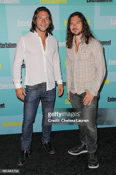 Actors Zach McGowan and Luke Arnold arrive at the Entertainment Weekly celebration at Float at Hard Rock Hotel San Diego on July 11, 2015 in San...