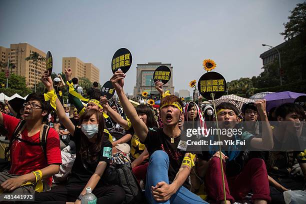 Protesters shout slogans during a rally called by the student groups occupying the Legislature Yuan on March 30, 2014 in Taipei, Taiwan. Taiwanese...