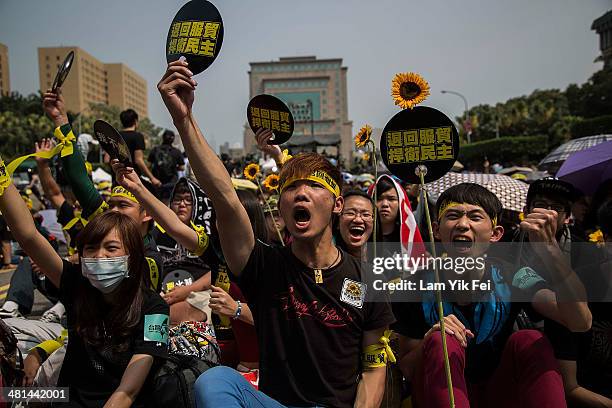 Protesters shout slogans during a rally called by the student groups occupying the Legislature Yuan on March 30, 2014 in Taipei, Taiwan. Taiwanese...