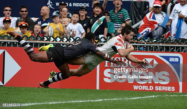 Danny Barrett of USA dives over but try disallowed during day 3 of the match between Fiji and USA 2014 HSBC Hong Kong Sevens at Hong Kong Stadium on...