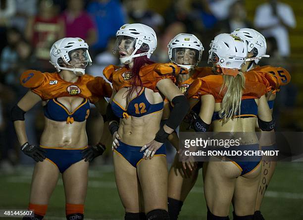 Players of the Diamond Team react in a match against Gold Team, during the game of the All Stars from Iberoamerican Bikini Football League, in Mexico...