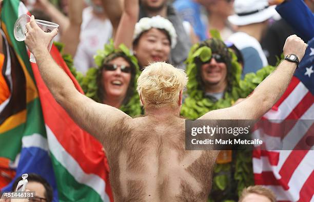 Fans enjoy the atmosphere during day three of the 2014 Hong Kong Sevens at Hong Kong International Stadium on March 30, 2014 in Hong Kong, Hong Kong.