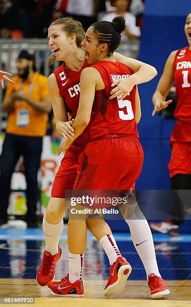 Katherine Plouffe and Kia Nurse of Canada celebrate their Gold medal win against the USA during the Women's Baskeball Finals at the Pan Am Games on...