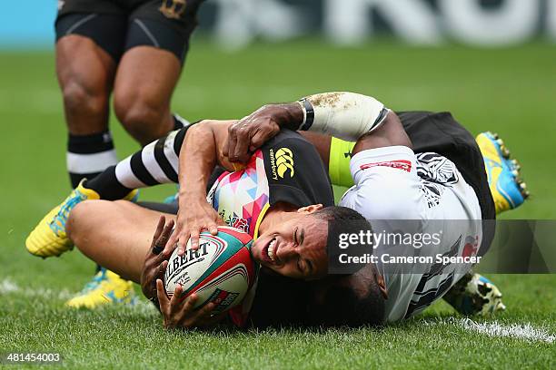 Marcus Watson of England scores a try during the Cup semi-final match between England and Fiji during the 2014 Hong Kong Sevens at Hong Kong...