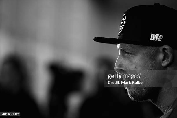 Australian surfer Mick Fanning listens to questions as he speaks to the media during a press conference at All Sorts Sports Factory on July 21, 2015...