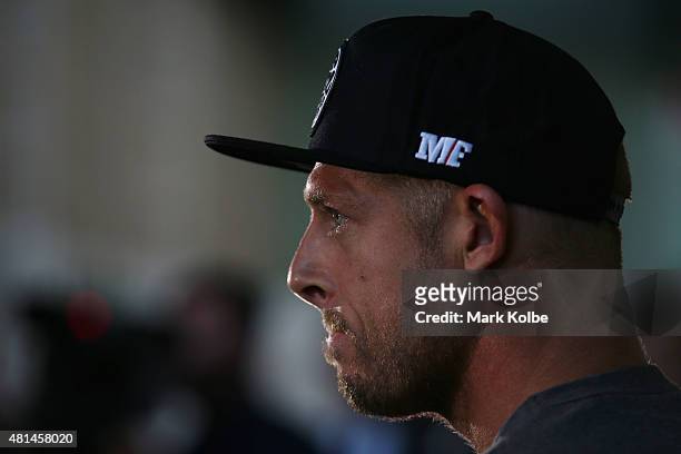 Australian surfer Mick Fanning listens to questions as he speaks to the media during a press conference at All Sorts Sports Factory on July 21, 2015...
