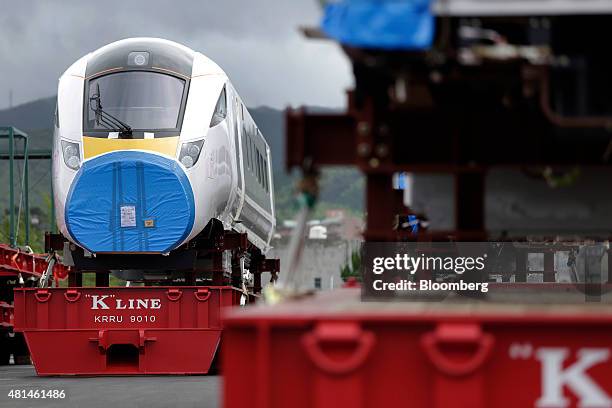 Class 800 Intercity Express train railcar, manufactured by Hitachi Ltd., sits as it waits to be loaded onto a roll-on/roll-off transporter vessel for...