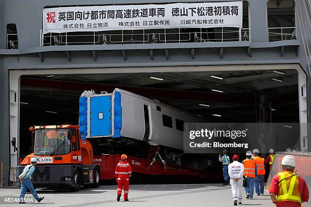 Class 800 Intercity Express train railcar, manufactured by Hitachi Ltd., is loaded onto the Hawaiian Highway roll-on/roll-off transporter vessel,...