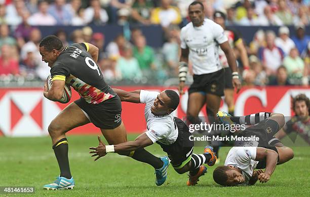 Marcus Watson of England is tackled during the Cup semi-final match between England and Fiji during day three of the 2014 Hong Kong Sevens at Hong...