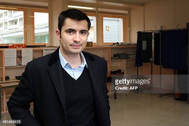 Xavier Bonnefont, French right-wing opposition Union for a Popular Movement candidate for the mayoral election in Angouleme, poses after voting in...