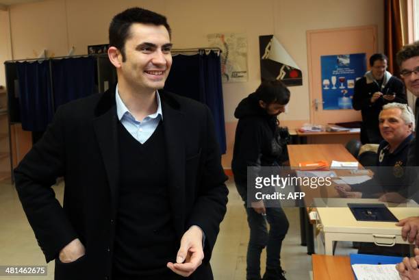 Xavier Bonnefont, French right-wing opposition Union for a Popular Movement candidate for the mayoral election in Angouleme, smiles after voting in...