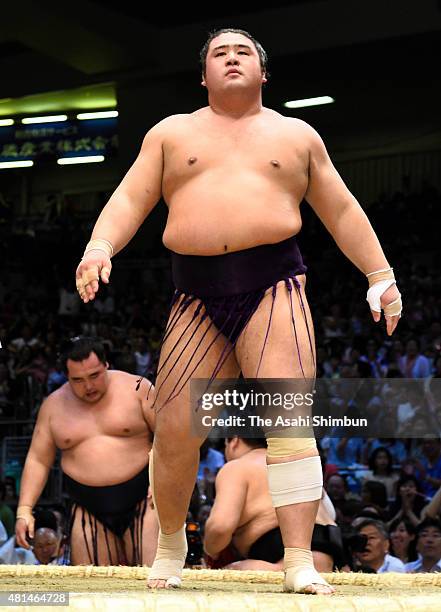 Tochiozan reacts after winning against Mongolian yokozuna Kakuryu during day nine of the Grand Sumo Nagoya Tournament at Aichi Prefecture Gymnasium...