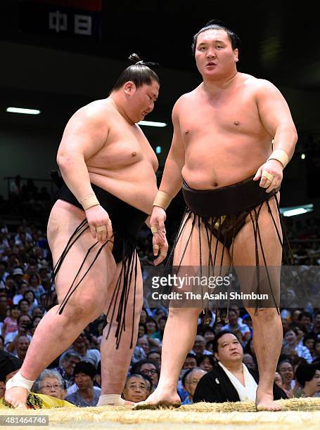 Mongolian yokozuna Hakuho reacts after beating his fellow sekiwake Ichinojo during day nine of the Grand Sumo Nagoya Tournament at Aichi Prefecture...