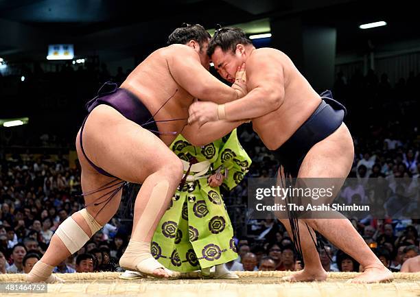 Tochiozan and Mongolian yokozuna Kakuryu compete during day nine of the Grand Sumo Nagoya Tournament at Aichi Prefecture Gymnasium on July 20, 2015...