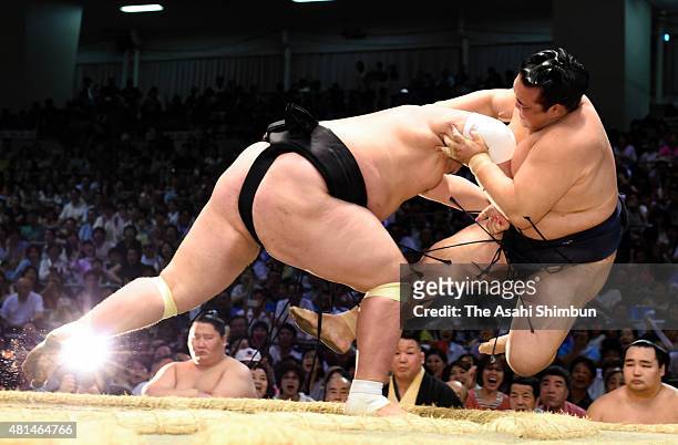 Mongolian ozeki Terunofuji throws ozeki Kisenosato to win during day nine of the Grand Sumo Nagoya Tournament at Aichi Prefecture Gymnasium on July...