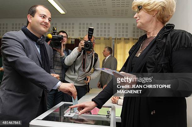 David Rachline , French far-right National Front party candidate for the municipal election in Frejus, casts his ballot in the second round of the...