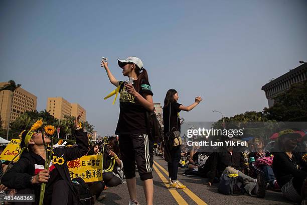 Protesters shout slogans as over two hundred thousand people rally on March 30, 2014 in Taipei, Taiwan. Taiwanese student protesters opposing the...