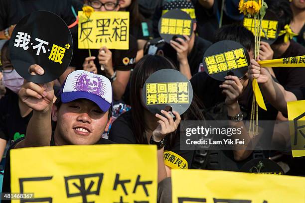 Protesters hold signs as over two hundred thousand people rally on March 30, 2014 in Taipei, Taiwan. Taiwanese student protesters opposing the...