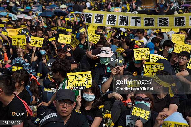 Protestors holds signs as over two hundred thousand people rally on March 30, 2014 in Taipei, Taiwan. Taiwanese student protesters opposing the...