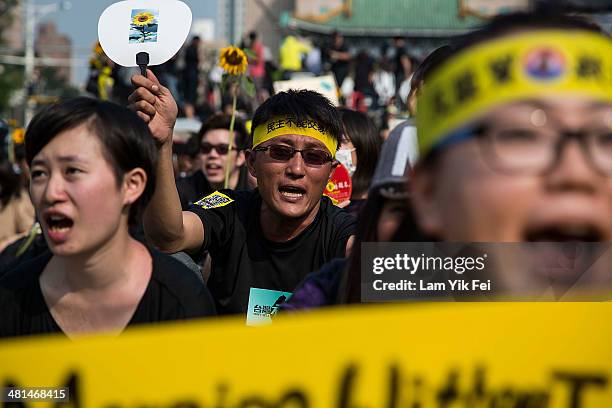 Protesters shout slogans as over two hundred thousand people rally on March 30, 2014 in Taipei, Taiwan. Taiwanese student protesters opposing the...