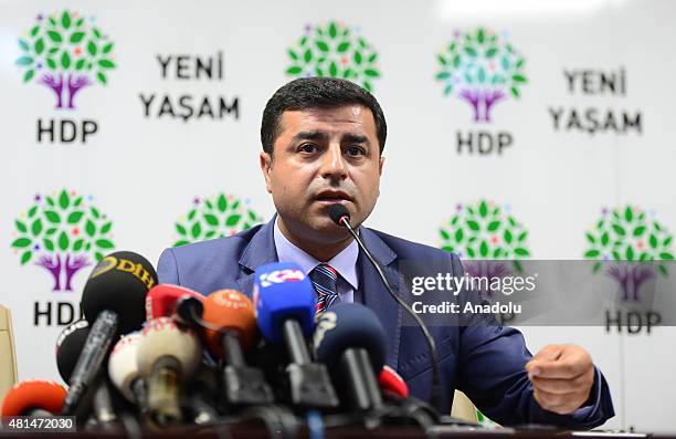 People's Democratic Party co-chairs Selahattin Demirtas and Figen Yuksekdag hold a press conference about explosion targeting a cultural center in...