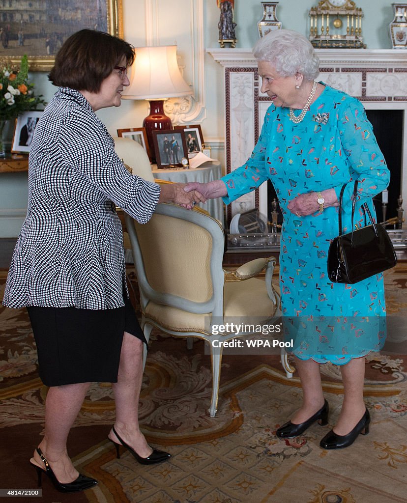 Queen Elizabeth II Receives Jocelyn Roy-Vienneau her husband Ronald at Buckingham Palace
