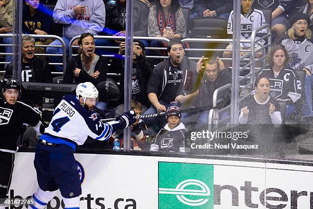 Wolfgang Van Halen and Eddie Van Halen attend a hockey game between the Winnipeg Jets and the Los Angeles Kings at Staples Center on March 29, 2014...