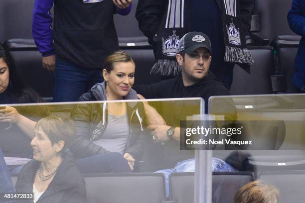 Alyssa Milano and Dave Bugliari attend a hockey game between the Winnipeg Jets and the Los Angeles Kings at Staples Center on March 29, 2014 in Los...