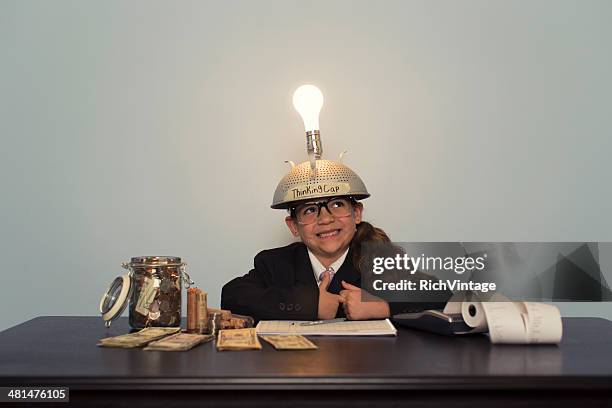 young girl in business suit wearing thinking cap - resourceful bildbanksfoton och bilder