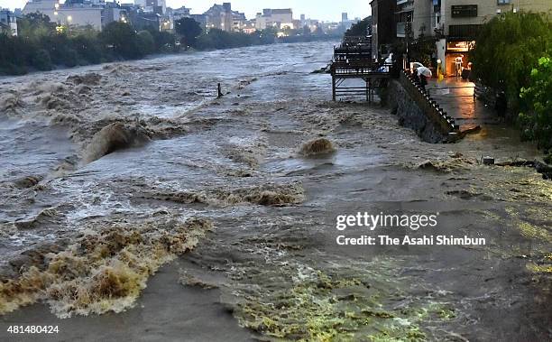 Swollen Kamogawa River is seen as the Typhoon Nangka hits Western Japan on July 18, 2015 in Kyoto, Japan. Japan Meteorological Agency has issued...