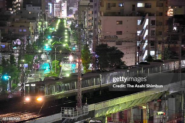 Train stands between Hyogo and Kobe station as the service suspended as the Typhoon Nangka hits Western Japan on July 18, 2015 in Kobe, Hyogo, Japan....