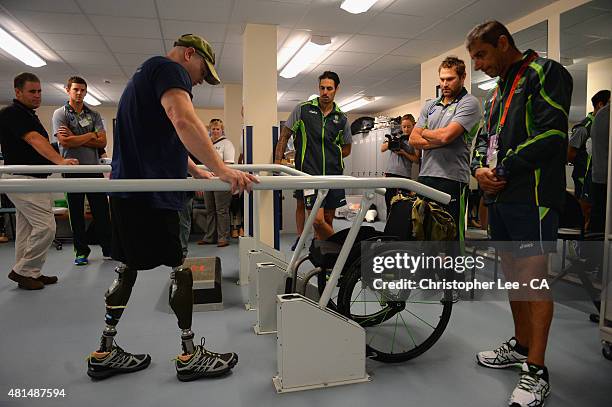 Australian cricket player's Josh Hazelwood, Mitchel Johnson and Ryan Harris talk to James Wilson as they visit Headley Court Military Rehabilitative...