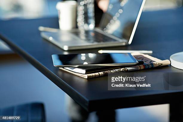 tablet on top of notebook and newspaper - digital publication stock pictures, royalty-free photos & images