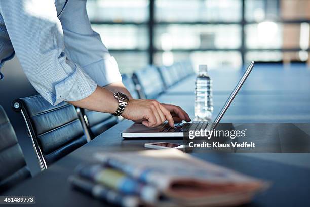 close-up of hands writing on laptop at big office - topnews stock pictures, royalty-free photos & images